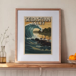 Sebastian Inlet Surf Travel Poster print in a Red Oak frame with a white mat, leaning on the ledge against the wall in a hallway.