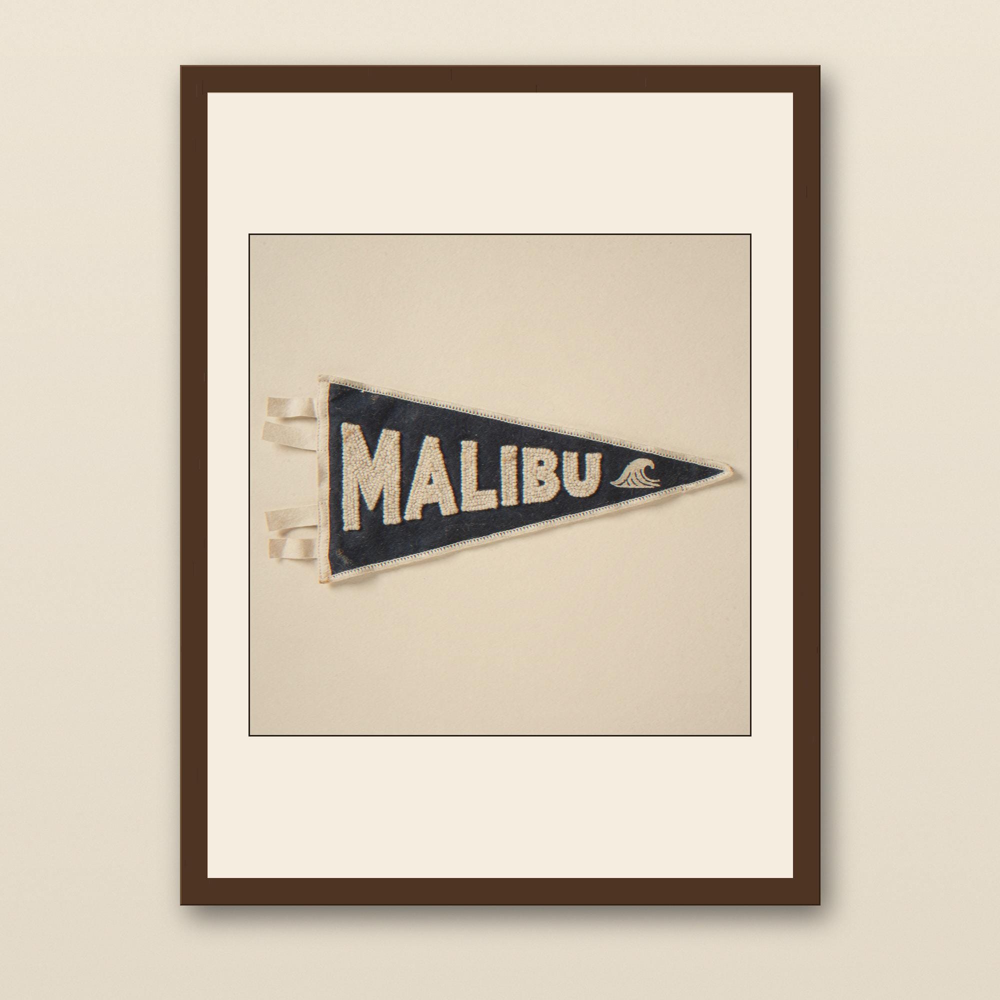 Malibu Vintage Surf Pennant Print - walnut framed art print with cream mat on plaster wall