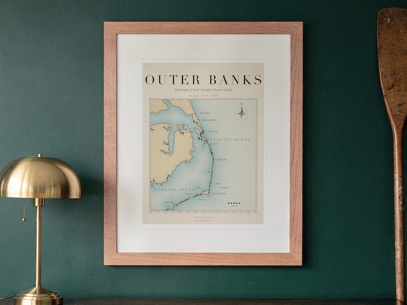 Outer Banks Surf Map print in a Red Oak frame with a white mat, hanging above the sideboard in a green study.