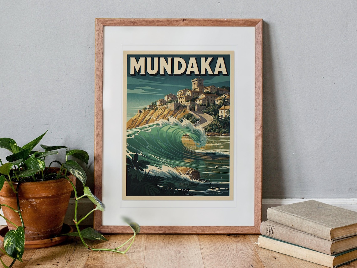 Mundaka Spain Surf Travel Poster print in a Red Oak frame with a white mat, standing on the floor, leaning back slightly against the wall in a living room floor lean.