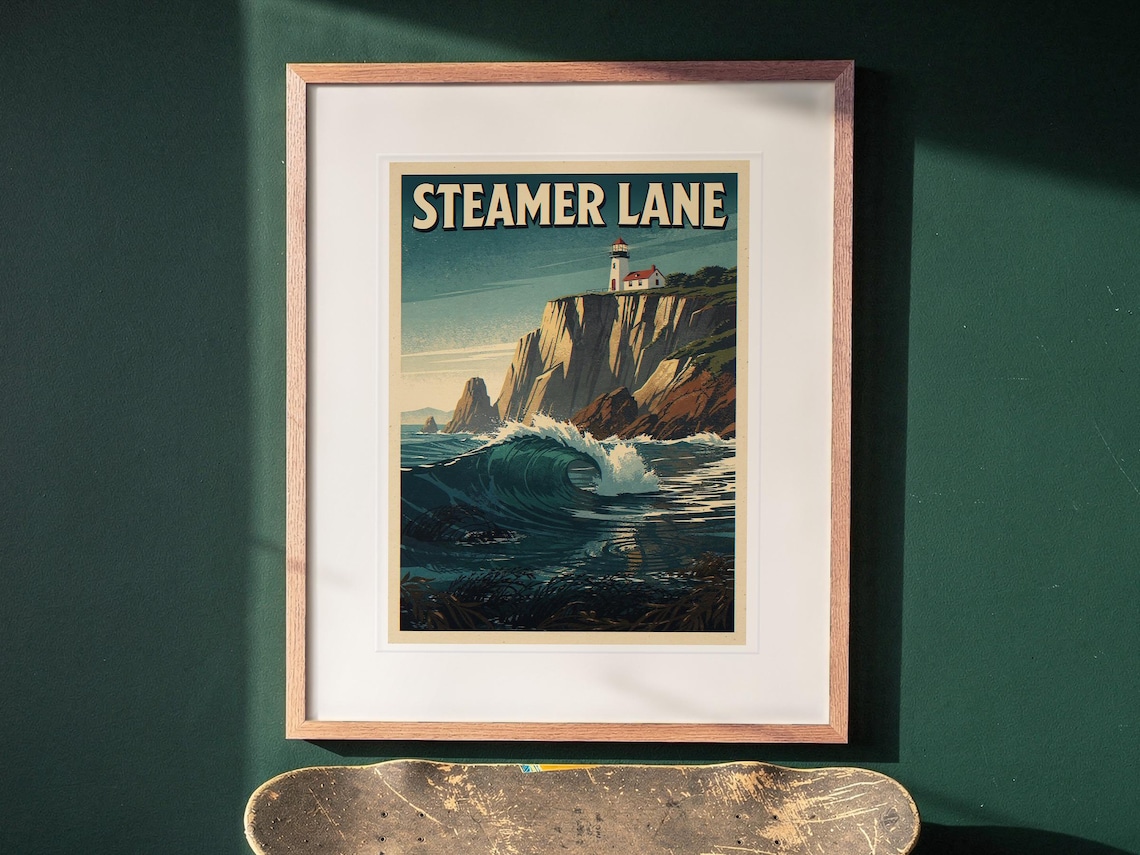Steamer Lane Surf Travel Poster print in a Red Oak frame with a white mat, hanging above the desk in a green study.