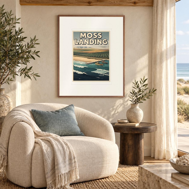 Moss Landing Surf print in a Red Oak frame with a white mat in a light-filled coastal sitting room.