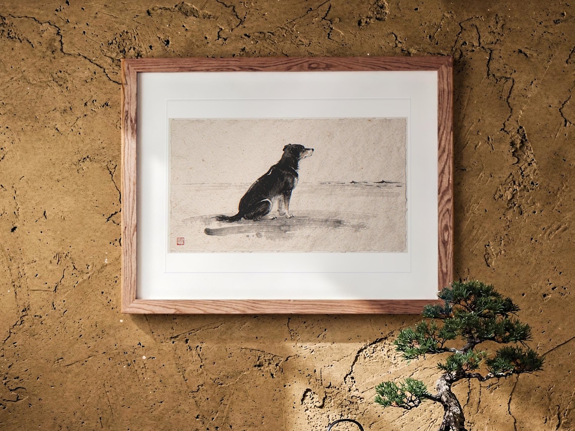 Dog Gazing at the Sea Xieyi Ink print in a Red Oak frame with a white mat, leaning against the wall above the tea table in a tea room.