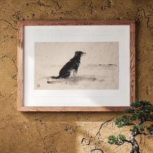 Dog Gazing at the Sea Xieyi Ink print in a Red Oak frame with a white mat, leaning against the wall above the tea table in a tea room.