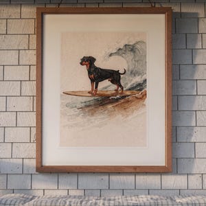 Doberman Surfing printable art, shown printed in a Red Oak frame with a white mat, hanging above the bench in a screened beach porch.