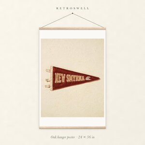New Smyrna Beach Surf Pennant oak hanger poster, 24 by 36 inches, with natural wood rails and a hanging cord.