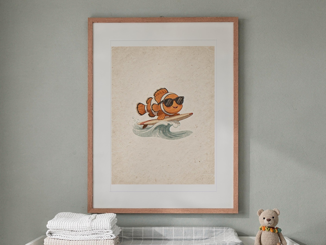Surfing Clownfish print in a Red Oak frame with a white mat, hanging above the dresser in a nursery.