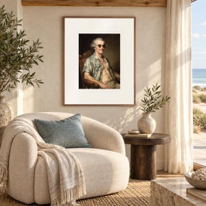 James Madison Surfer print in a Red Oak frame with a white mat in a light-filled coastal sitting room.