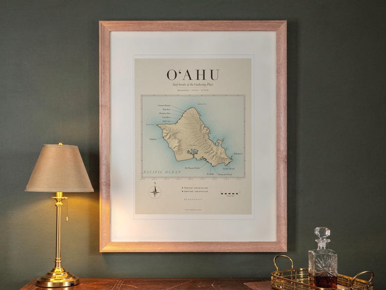 Oahu Surf Map print in a Red Oak frame with a white mat, hanging above the desk in a green study.