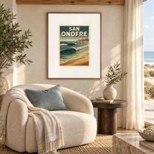 San Onofre Surf print in a Red Oak frame with a white mat in a light-filled coastal sitting room.