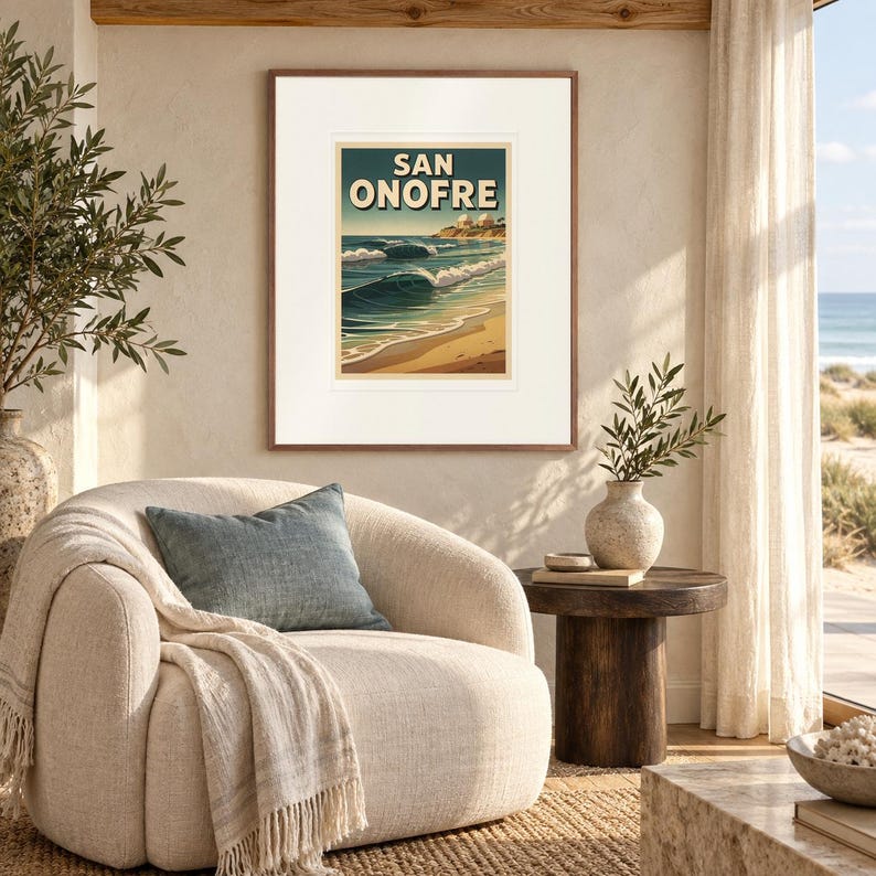 San Onofre Surf print in a Red Oak frame with a white mat in a light-filled coastal sitting room.