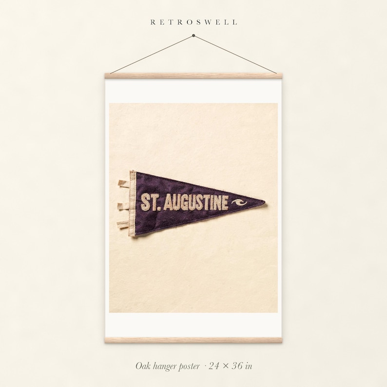 St. Augustine Surf Pennant oak hanger poster, 24 by 36 inches, with natural wood rails and a hanging cord.