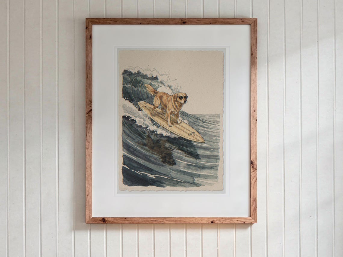 Golden Retriever Surfing print in a Red Oak frame with a white mat, hanging above the desk in a kids' room.