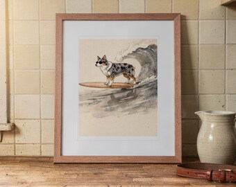 May include: A framed print featuring a watercolor illustration of a blue merle Australian Shepherd wearing sunglasses while standing on a surfboard riding a large ocean wave. The artwork is enclosed in a light brown wooden frame with a white mat.