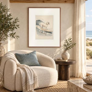 Poodle Surfing print in a Red Oak frame with a white mat in a light-filled coastal sitting room.