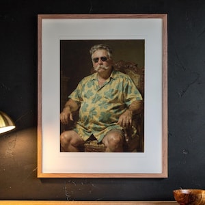 William Howard Taft Surfer printable art, shown printed in a Red Oak frame with a white mat, hanging above the desk in a home office.