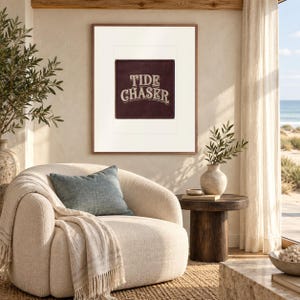 Tide Chaser Patch print in a Red Oak frame with a white mat in a light-filled coastal sitting room.