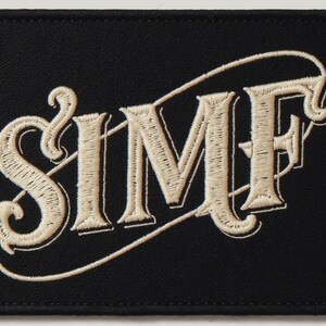 Surf Embroidered Patch Print framed in a coastal dining room setting