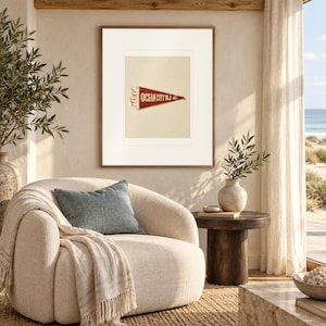Ocean City, New Jersey Surf Pennant print in a Red Oak frame with a white mat in a light-filled coastal sitting room.