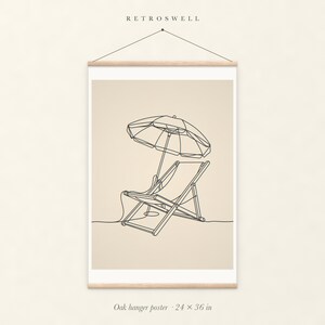 Beach Chair and Umbrella Line oak hanger poster, 24 by 36 inches, with natural wood rails and a hanging cord.