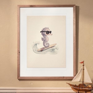Seahorse Surfing print in a Red Oak frame with a white mat, hanging above the bookshelf in a nursery.