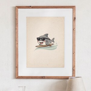 Shark Surfing print in a Red Oak frame with a white mat, hanging above the bedside table in a calm bedroom.