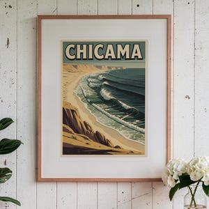 Chicama Peru Surf Travel Poster print in a Red Oak frame with a white mat, hanging above the table in a sunroom.