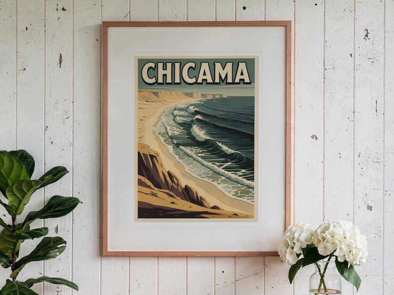 Chicama Peru Surf Travel Poster print in a Red Oak frame with a white mat, hanging above the table in a sunroom.