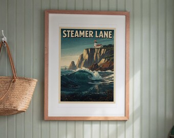 May include: A framed wall art print titled STEAMER LANE featuring a coastal scene with a lighthouse perched on a high cliff overlooking a large breaking ocean wave. The artwork uses a palette of deep blues, greens, and warm beige tones.