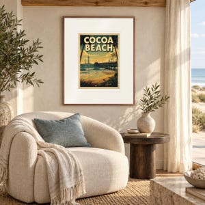 Cocoa Beach Surf print in a Red Oak frame with a white mat in a light-filled coastal sitting room.