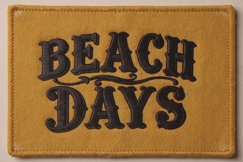 Beach Days Embroidered Patch Print framed in a coastal dining room setting