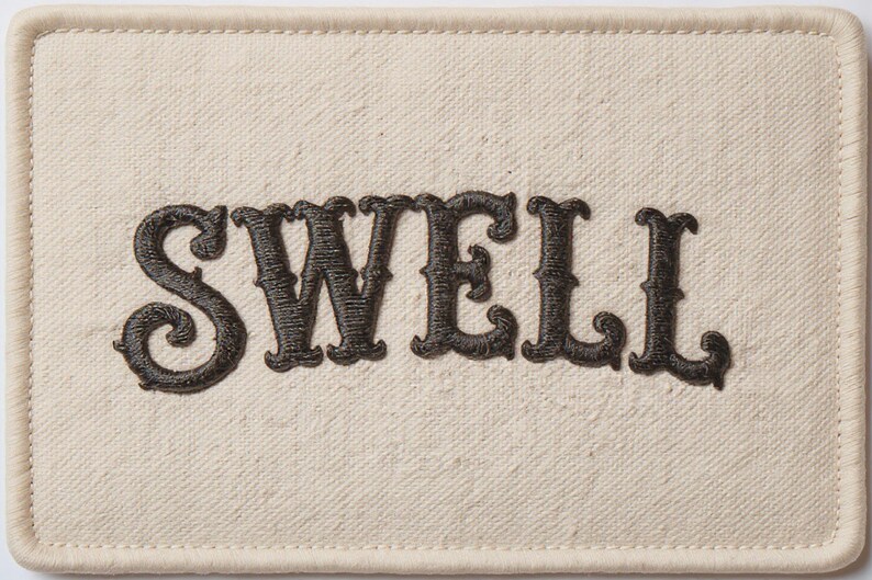 Swell Embroidered Patch Print framed in a modern bedroom setting
