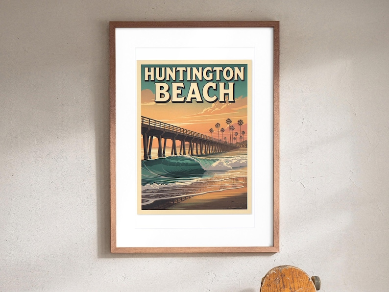Huntington Beach Surf Travel Poster print in a Red Oak frame with a white mat, hanging above the console in a hallway.