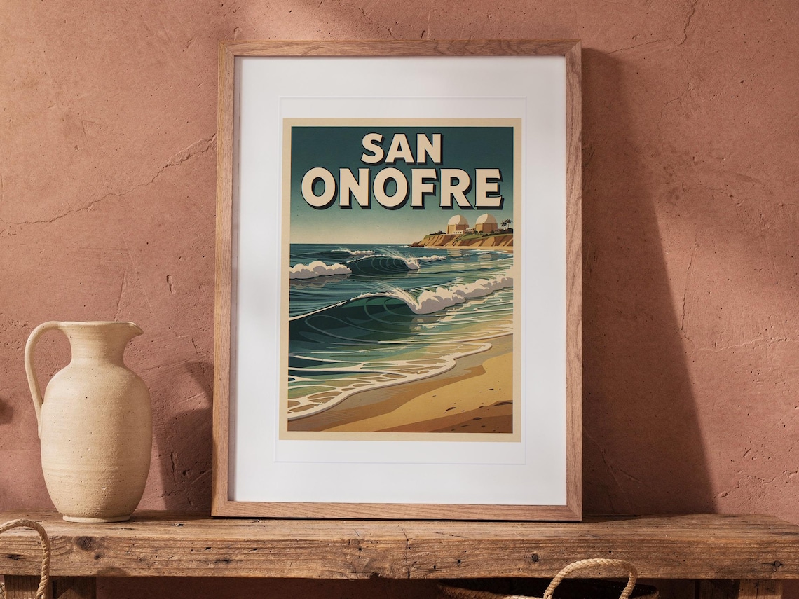 San Onofre Surf Travel Poster print in a Red Oak frame with a white mat, leaning on the bench against the wall in a boho living room.