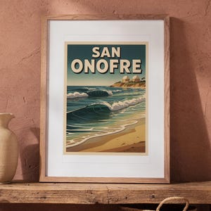 San Onofre Surf Travel Poster print in a Red Oak frame with a white mat, leaning on the bench against the wall in a boho living room.