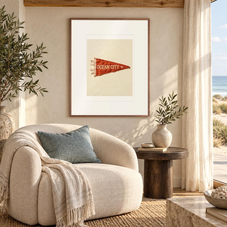 Ocean City, Maryland Surf Pennant print in a Red Oak frame with a white mat in a light-filled coastal sitting room.