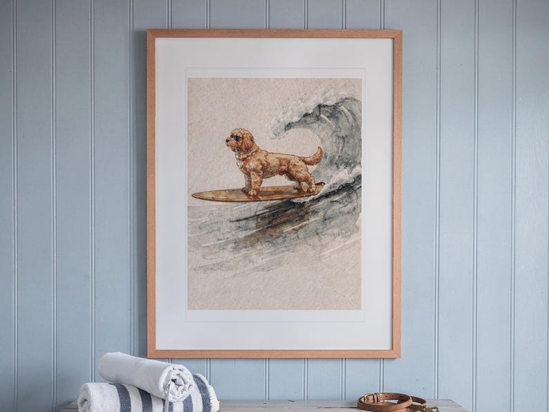 Goldendoodle Surfing print in a Red Oak frame with a white mat, hanging above the console in a beach cottage entryway.