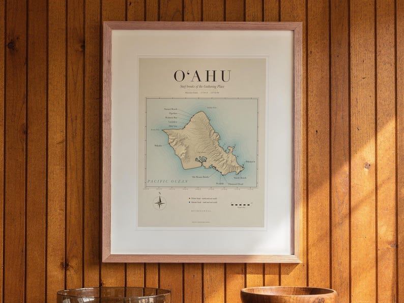 Oahu Surf Map printable art, shown printed in a Red Oak frame with a white mat, hanging above the credenza in a mid-century living room.