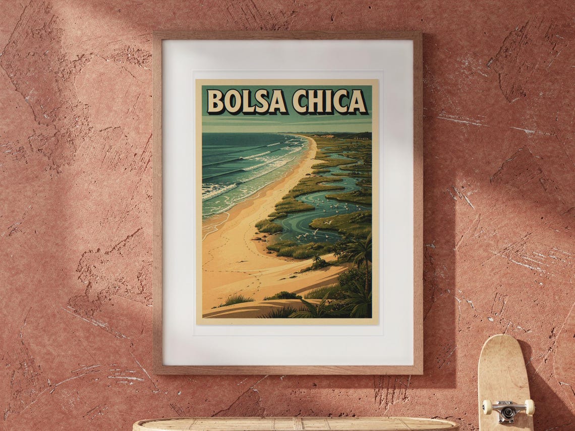 Bolsa Chica Surf Travel Poster print in a Red Oak frame with a white mat, hanging above the table in a boho living room.