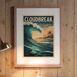 Cloudbreak Surf Travel Poster print in a Red Oak frame with a white mat, hanging above the desk in a home office.