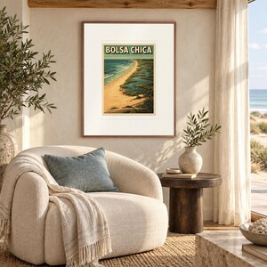 Bolsa Chica Surf print in a Red Oak frame with a white mat in a light-filled coastal sitting room.