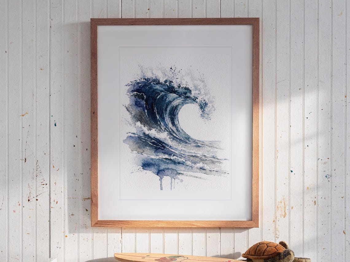 The Crest Wave Watercolor print in a Red Oak frame with a white mat, hanging above the bookshelf in a kids' room.