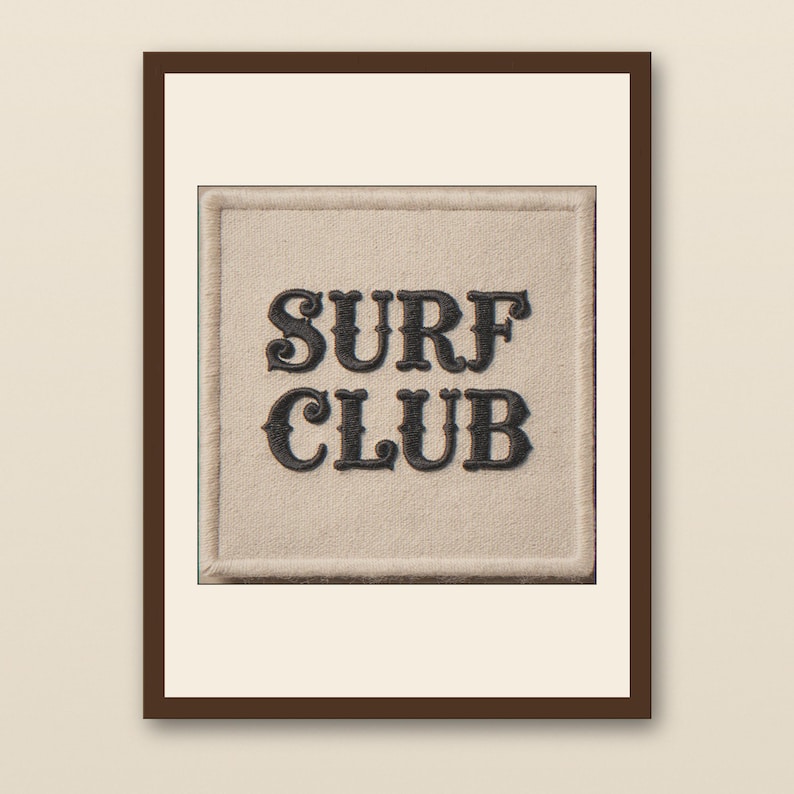 Surf Club Embroidered Patch Print - walnut framed art print with cream mat on plaster wall