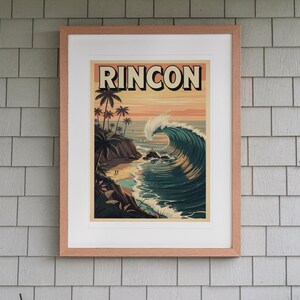 Rincon Surf Travel Poster print in a Red Oak frame with a white mat, hanging above the bench in a screened beach porch.