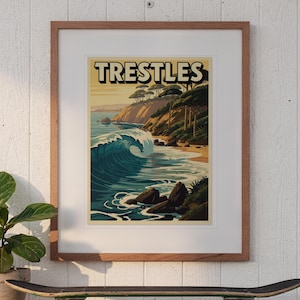 Trestles California Surf Travel Poster print in a Red Oak frame with a white mat, hanging above the console in a sunroom.