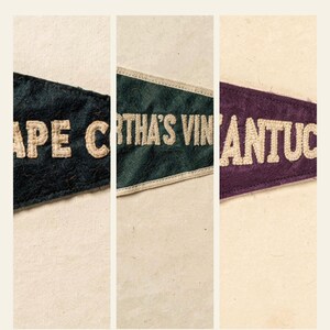 Close views of the navy, green, and burgundy felt textures and stitched location lettering in the three-print set