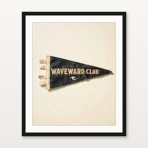 Waveward Club coastal surf pennant art presented in a matte black gallery frame