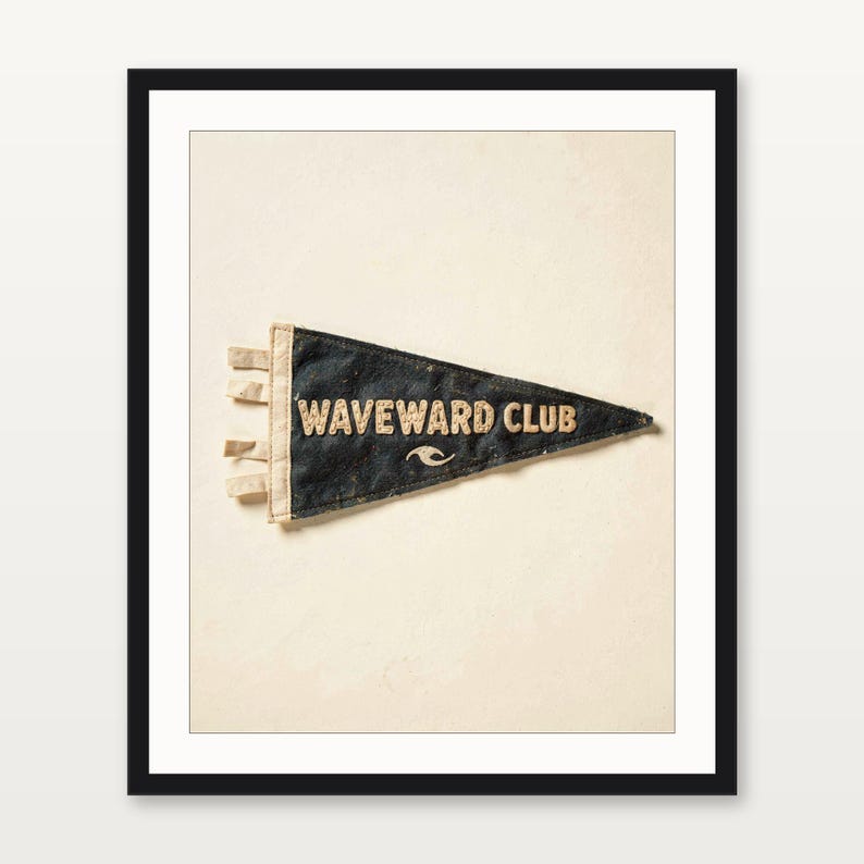 Waveward Club coastal surf pennant art presented in a matte black gallery frame