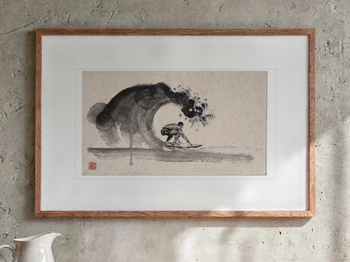 Surfer in the Barrel Xieyi Ink print in a Red Oak frame with a white mat, hanging above the sideboard in a dining room.