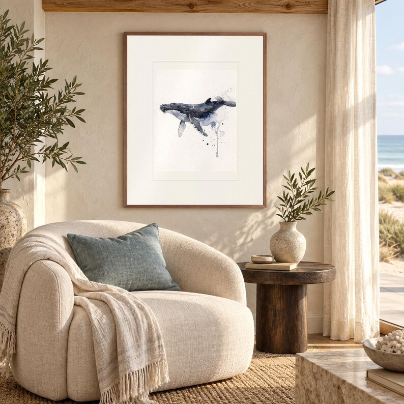 Humpback Whale print in a Red Oak frame with a white mat in a light-filled coastal sitting room.